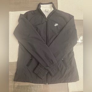 Women’s medium Nike wind jacket.